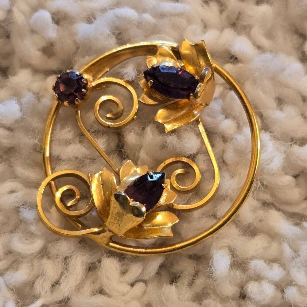 Vintage Gold Tone Floral Circle Brooch Featuring 3 purple rhinestones